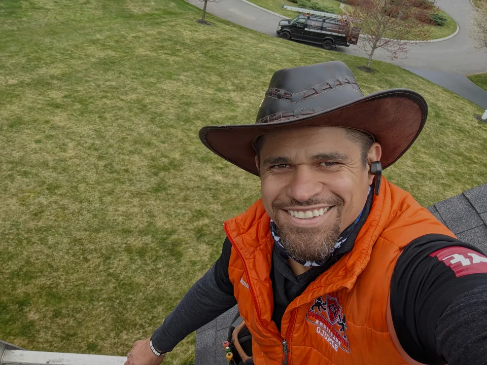 Romulo working on a roof